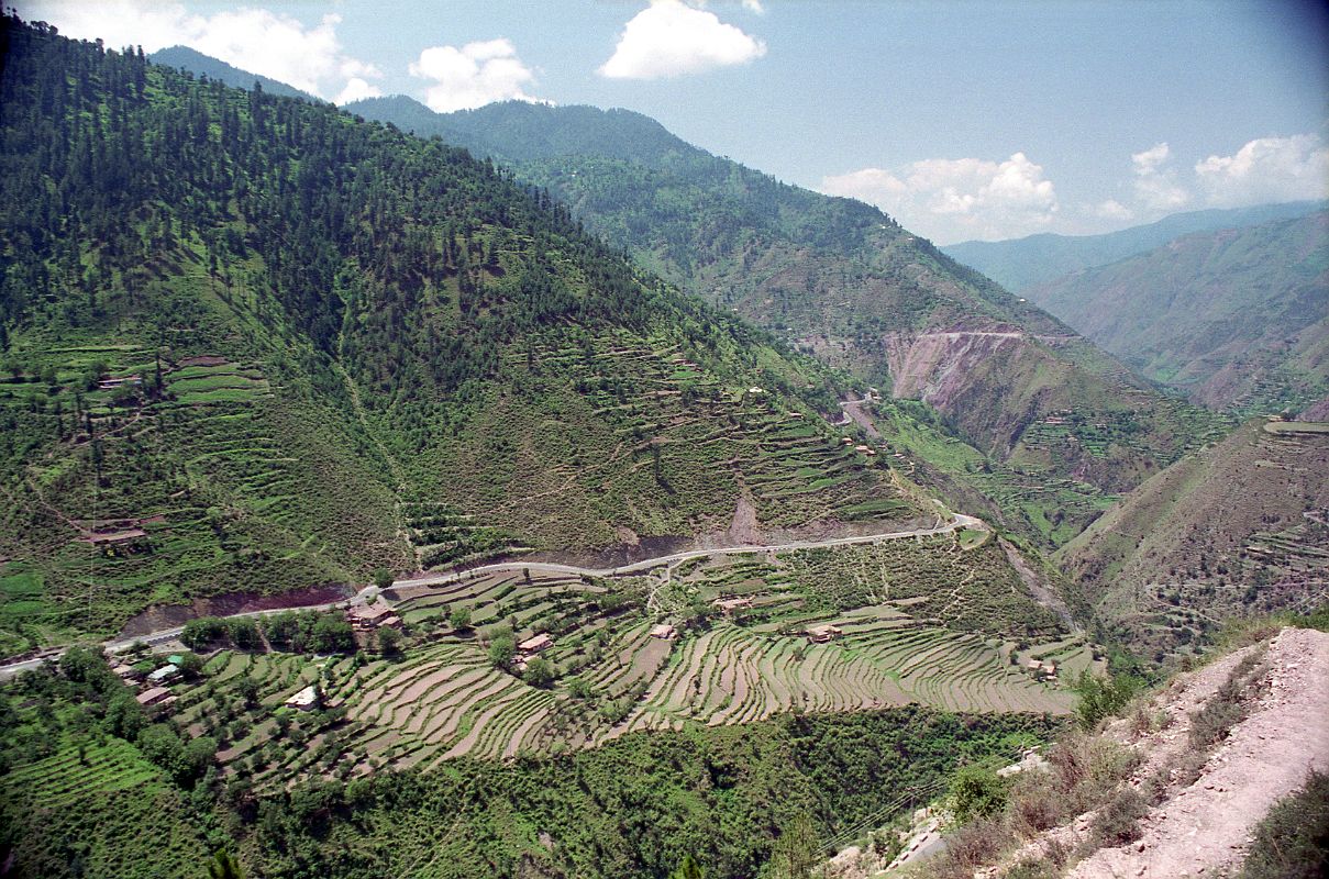 21 Two-Lane Road Through Fertile Green Countryside Kaghan Valley Ilys immediately transforms from an extremely cautious slow driver on dirt roads to a race car driver on paved roads swerving around each corner in the winding road. He has to be careful and watch out for children going to school, adults casually strolling, old men with canes, cows, goats, and donkeys on the edge of the road. Ilys had to constantly pass and avoid all manner of vehicles, including cars, jeeps, suvs, buses, trucks, vans, jeepneys, tractors, motorcycles, bicycles, and horse and donkey carts. The speed limit changed to 100 for the last 45km to Pindi as we drove on the 4-lane divided Peshawar Road to Pindi.